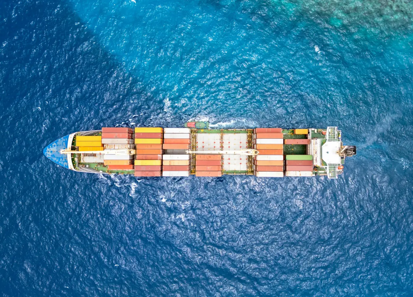 Aerial view of a cargo ship, symbolizing IDP's global trade and logistics capabilities